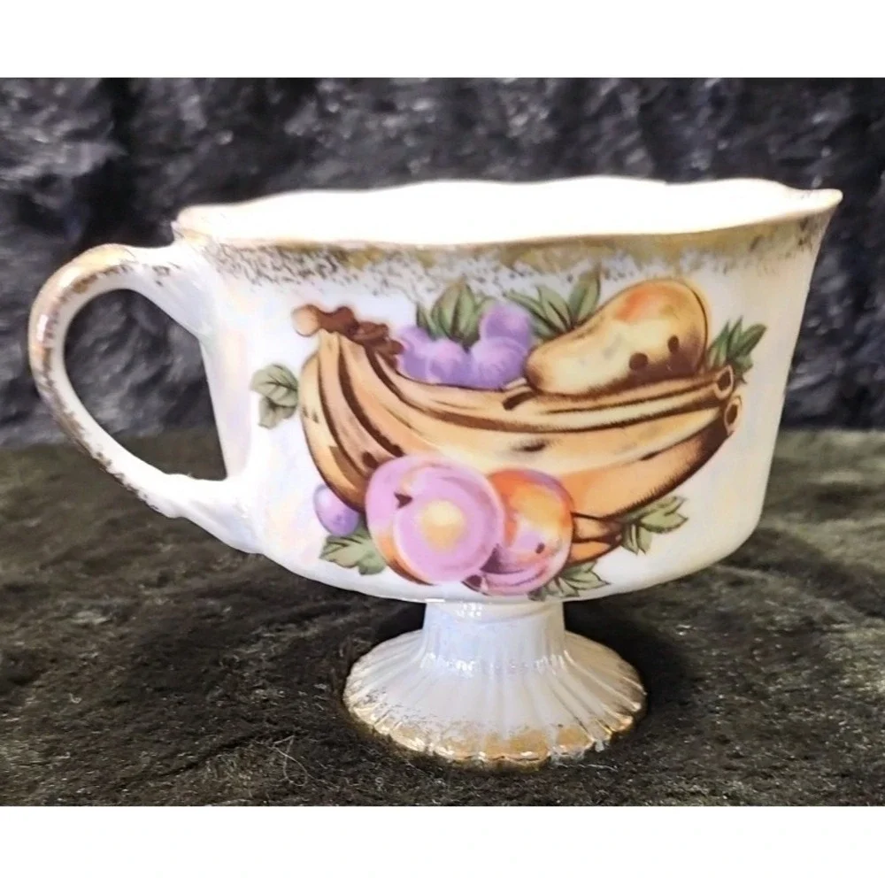 Lusterware Handpainted Fruit with gold finishings,‎ footed cup and saucer set